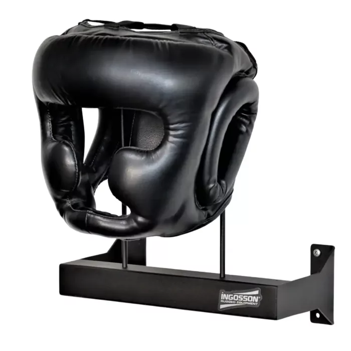 a glack boxing helmet on a wall mounting rack